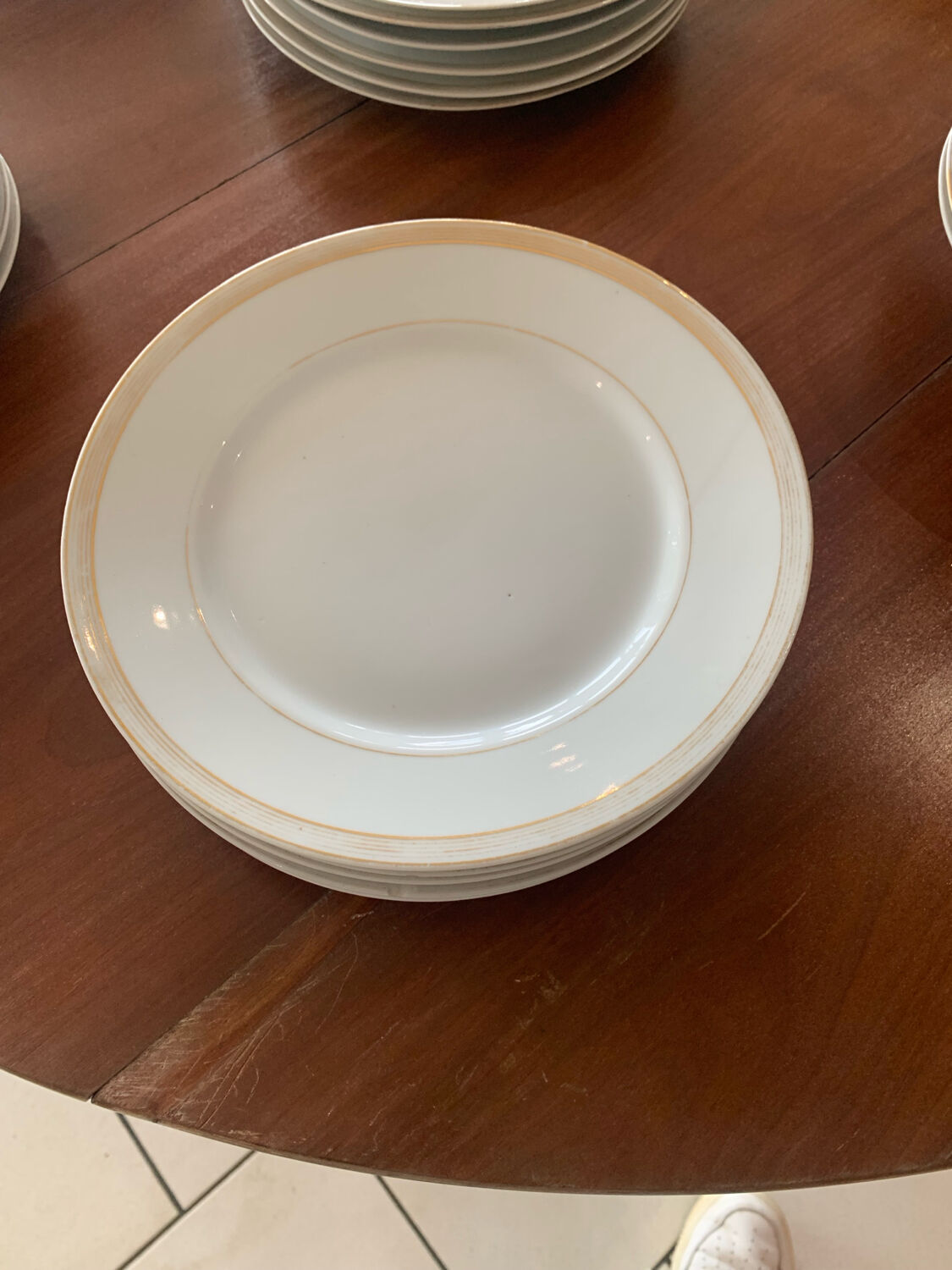 Lot of six flat plates, crockery, old white, gilded