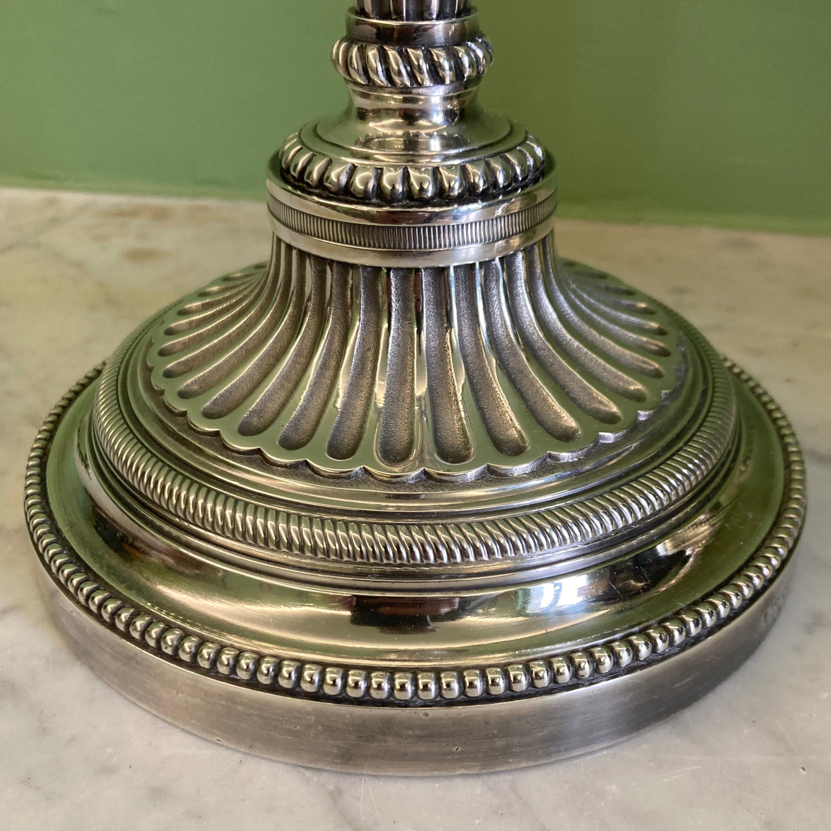 Pair of silvered bronze candlesticks from the 19th century in Louis XVI style signed Voisenet.