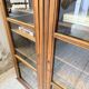 Glass-fronted walnut library 1900
