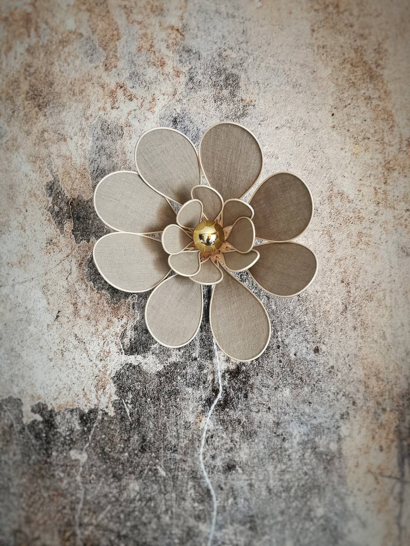 Flower wall light made of rattan and natural linen petals