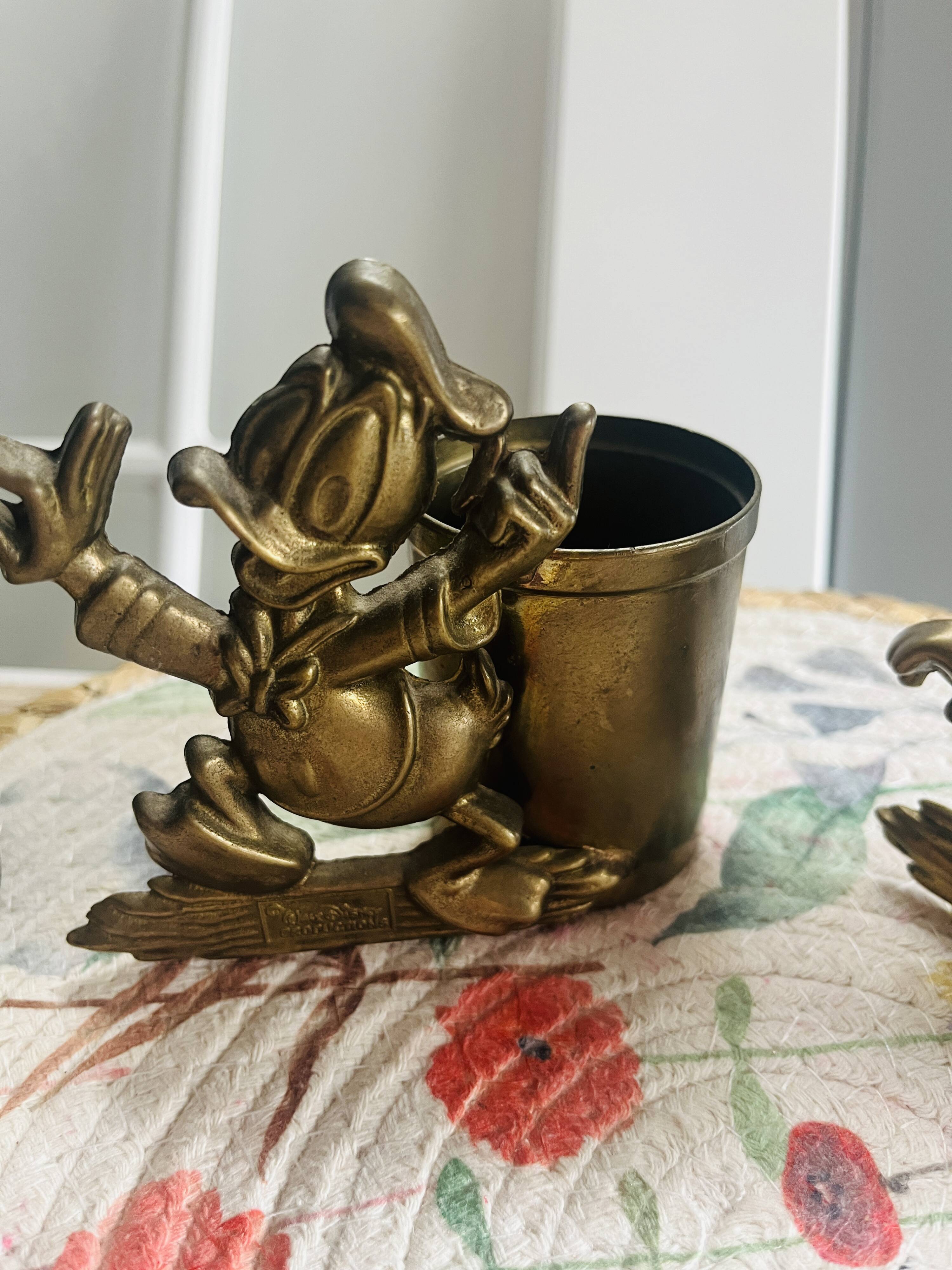 Rare brass yellow Disney pencil holders. 1960p