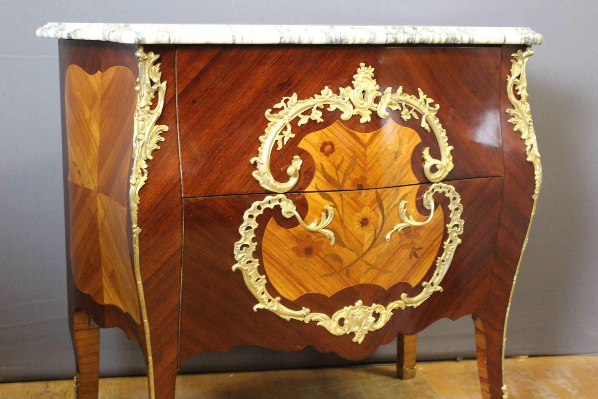 Louis XV style commode in marquetry around 1900