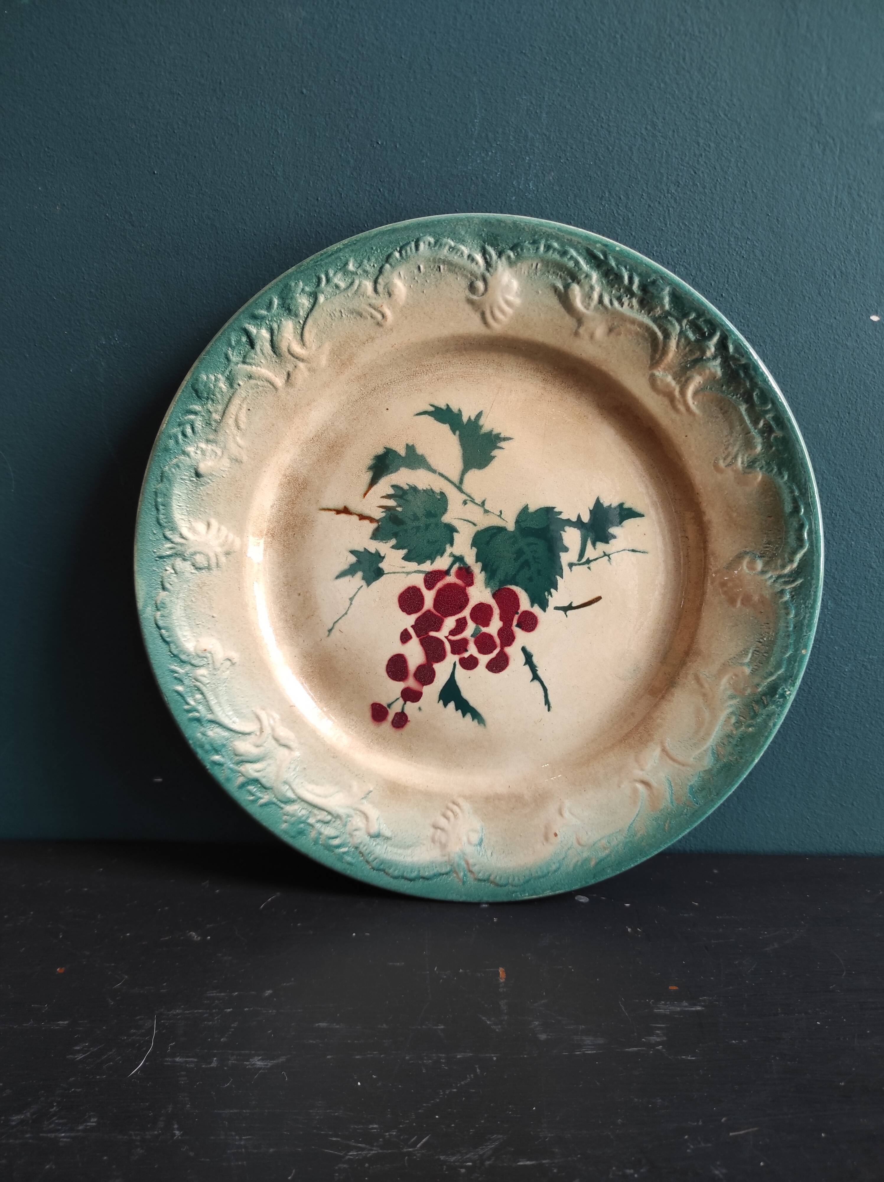 French antique barbotine plate decorated with stencil of grapes, faience de Castres