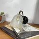 Pair of brass swan neck wall sconces, glass tulips with screen printing.