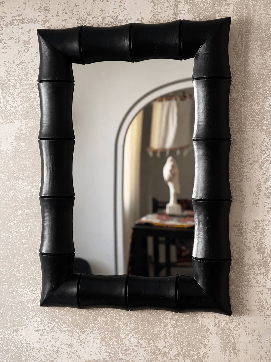 Rectangular mirror in patinated black wood resembling bamboo – 68 × 100 cm