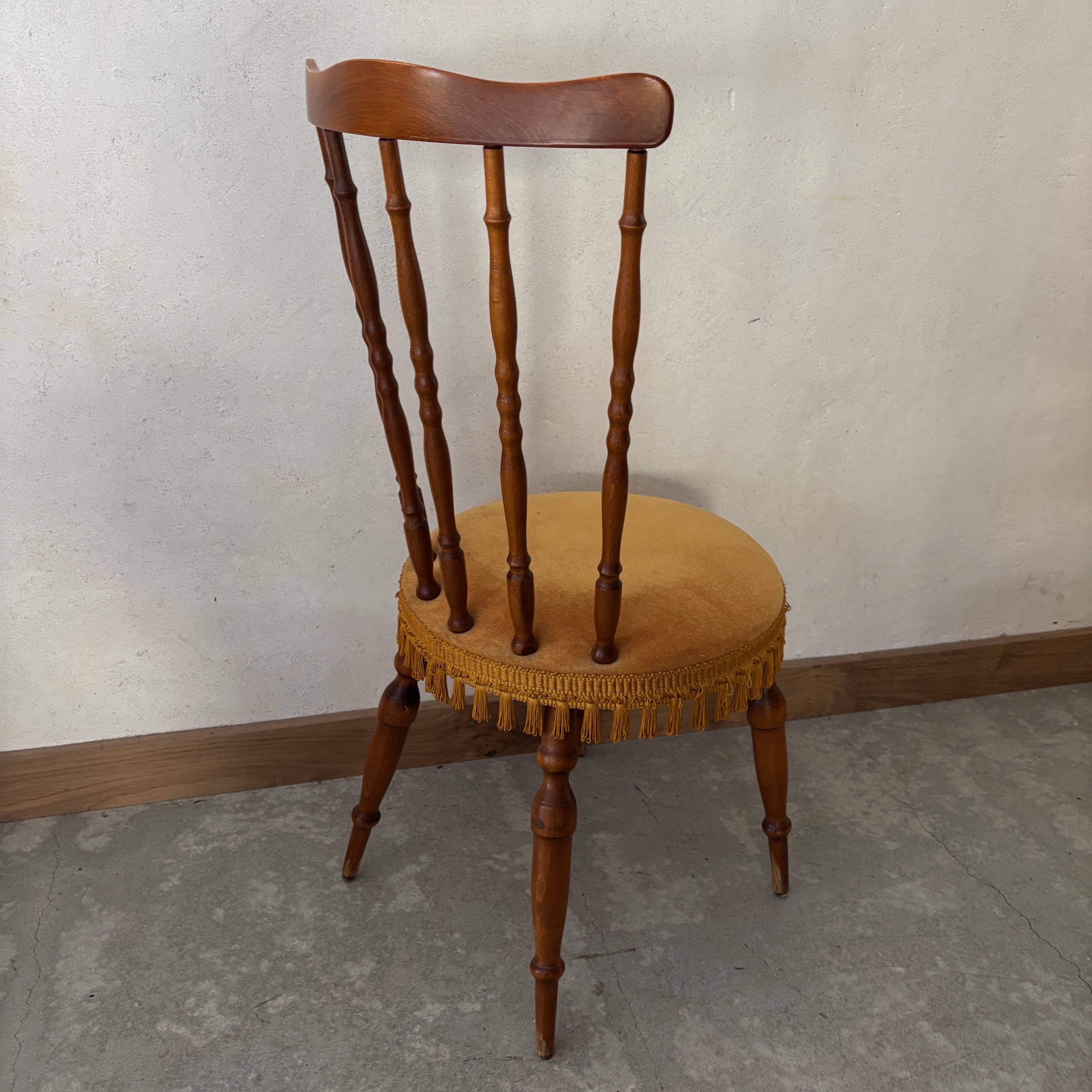 Wooden chair with yellow velvet
