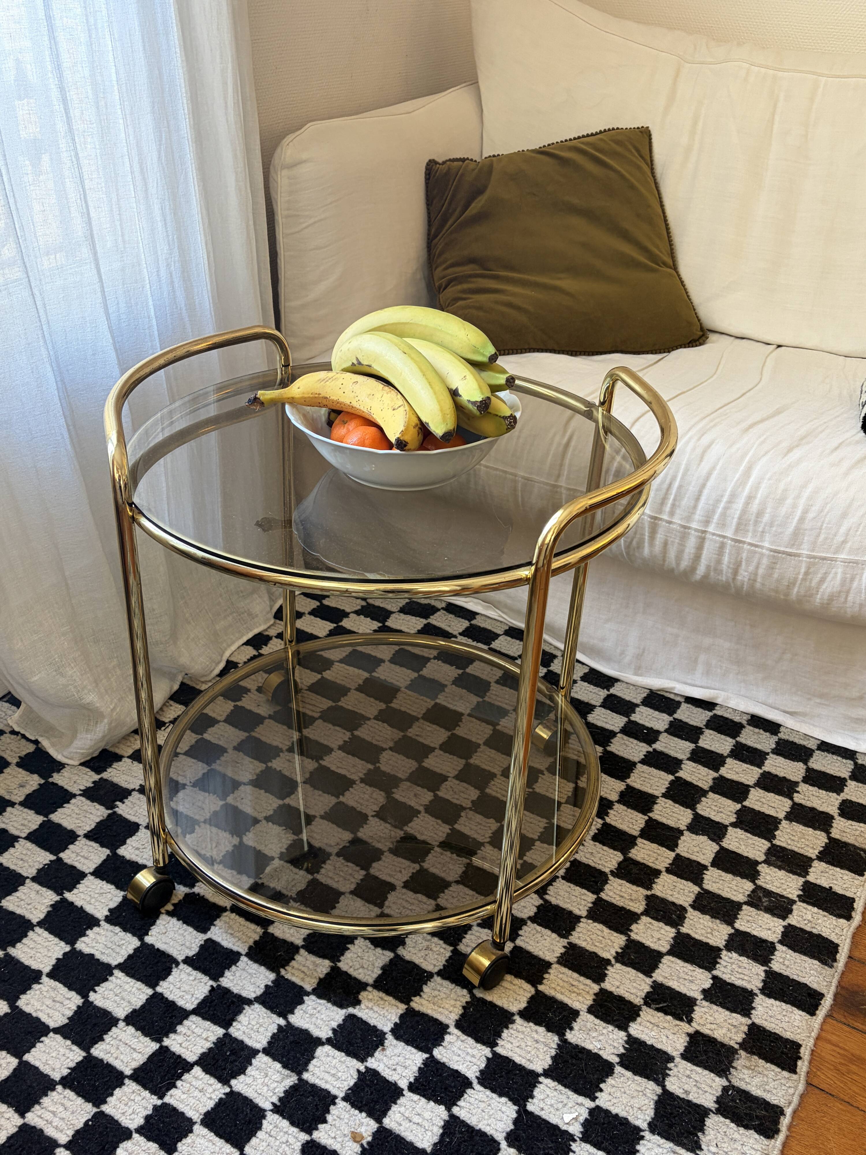 Vintage gold glass table on wheels