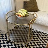 Vintage gold glass table on wheels