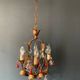 Antique chandelier in gilded sheet metal and red and white crystal pendants, 1900