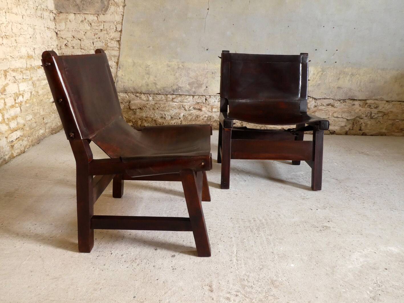 Pair of brutalist armchairs in wood and leather, 1970