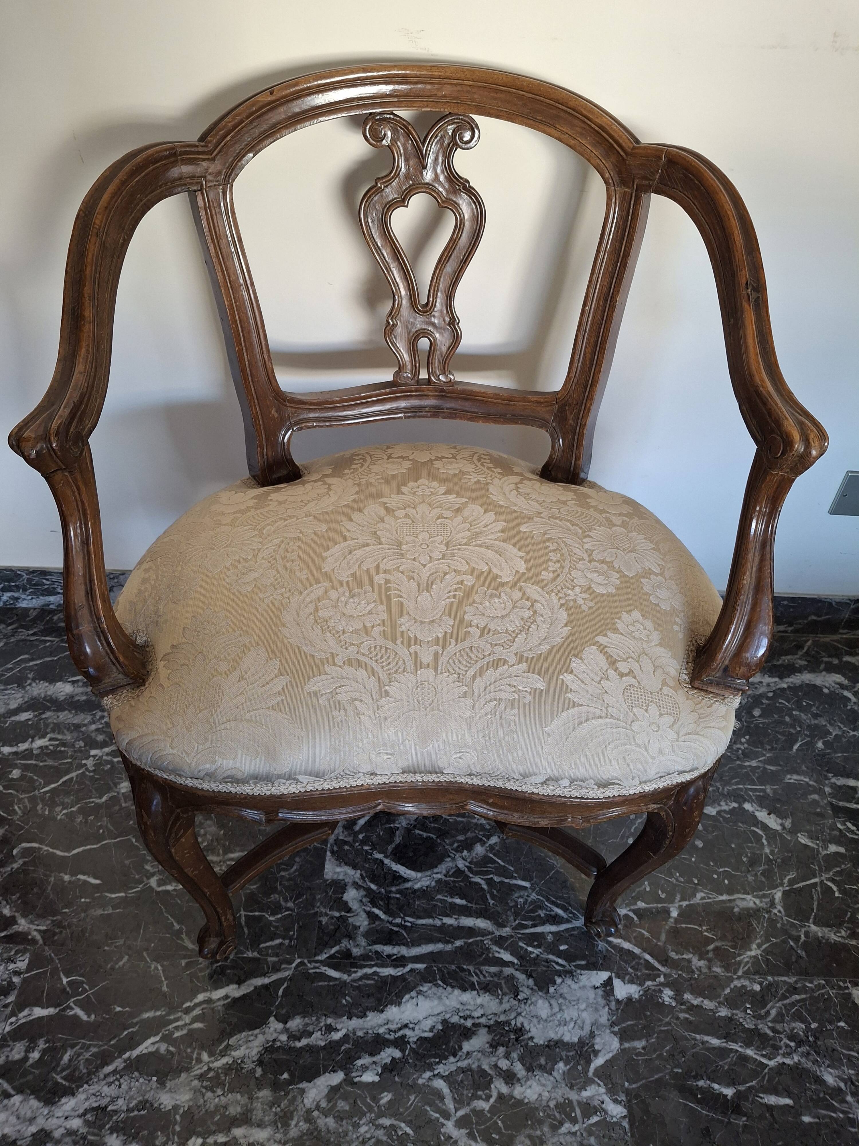 Pair of Italian armchairs from the 1960s with matching ottoman.