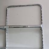 Chrome and glass wall shelf, circa 1960