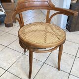 Bistro chair with a curved wooden frame and caned seat from the 1930s.