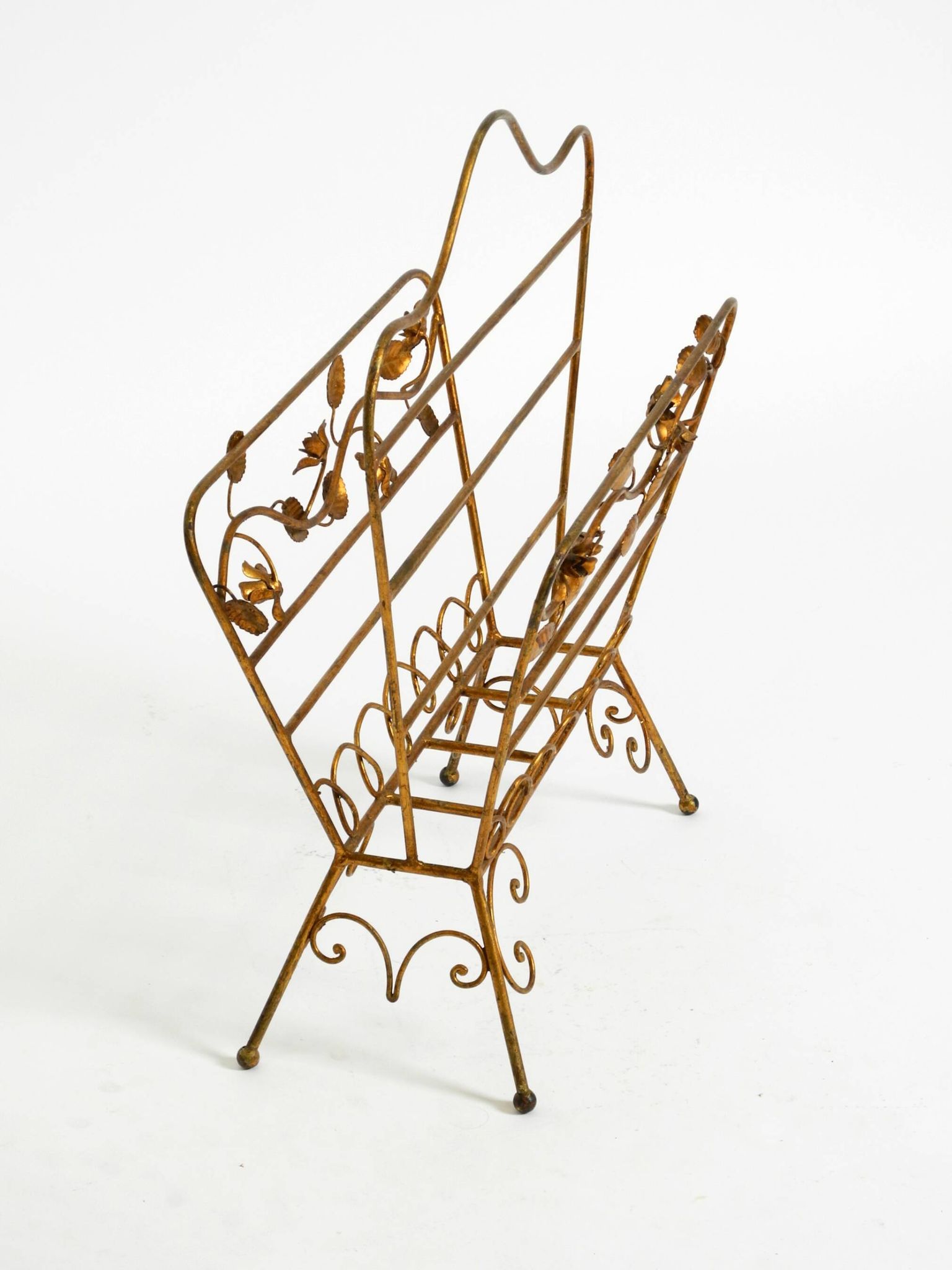 Extraordinary mid-century newspaper and magazine rack with a gilded metal