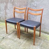 Pair of Scandinavian style chairs in wood and faux leather.
