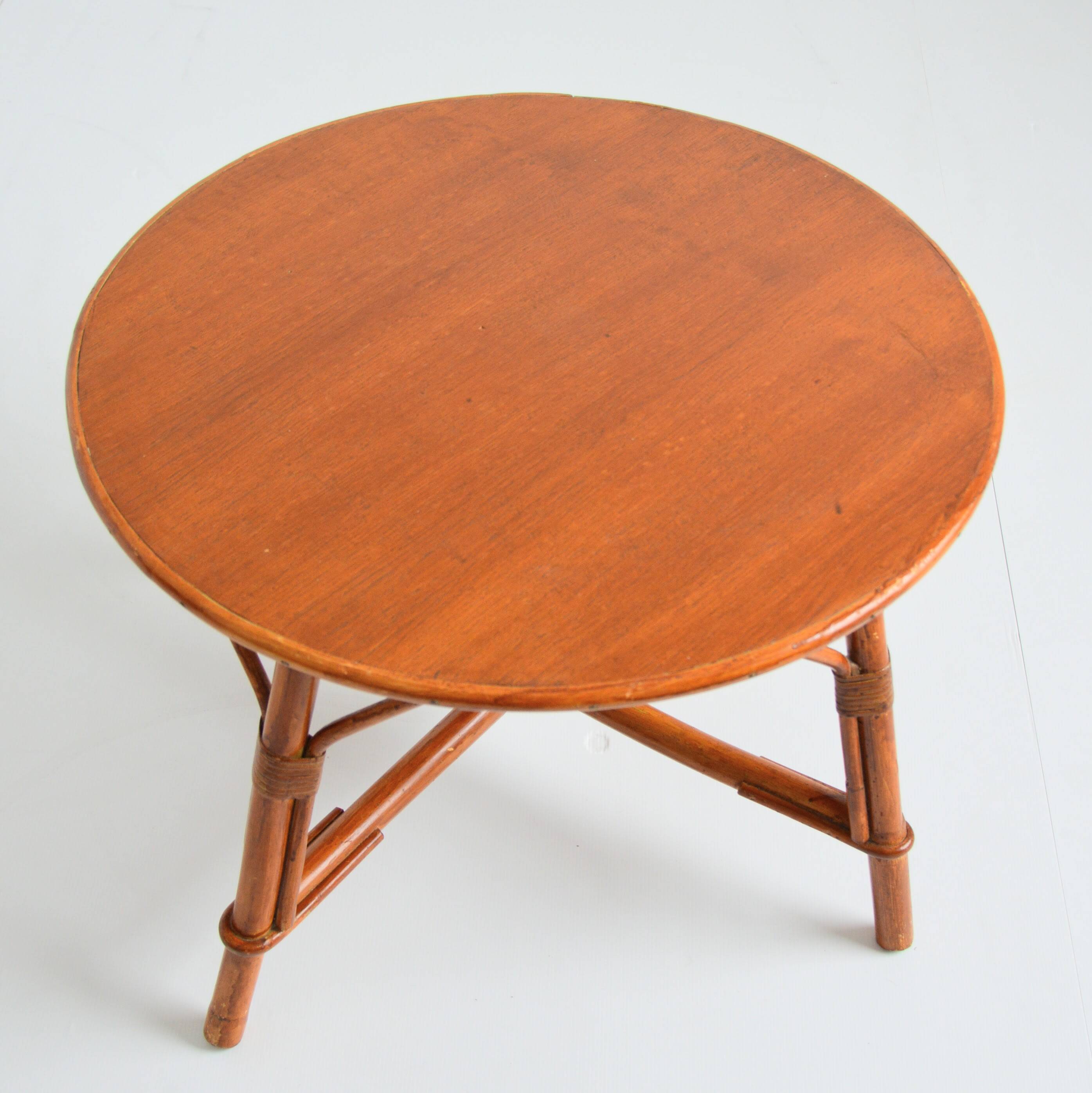 Vintage 1960s round wood and rattan coffee table