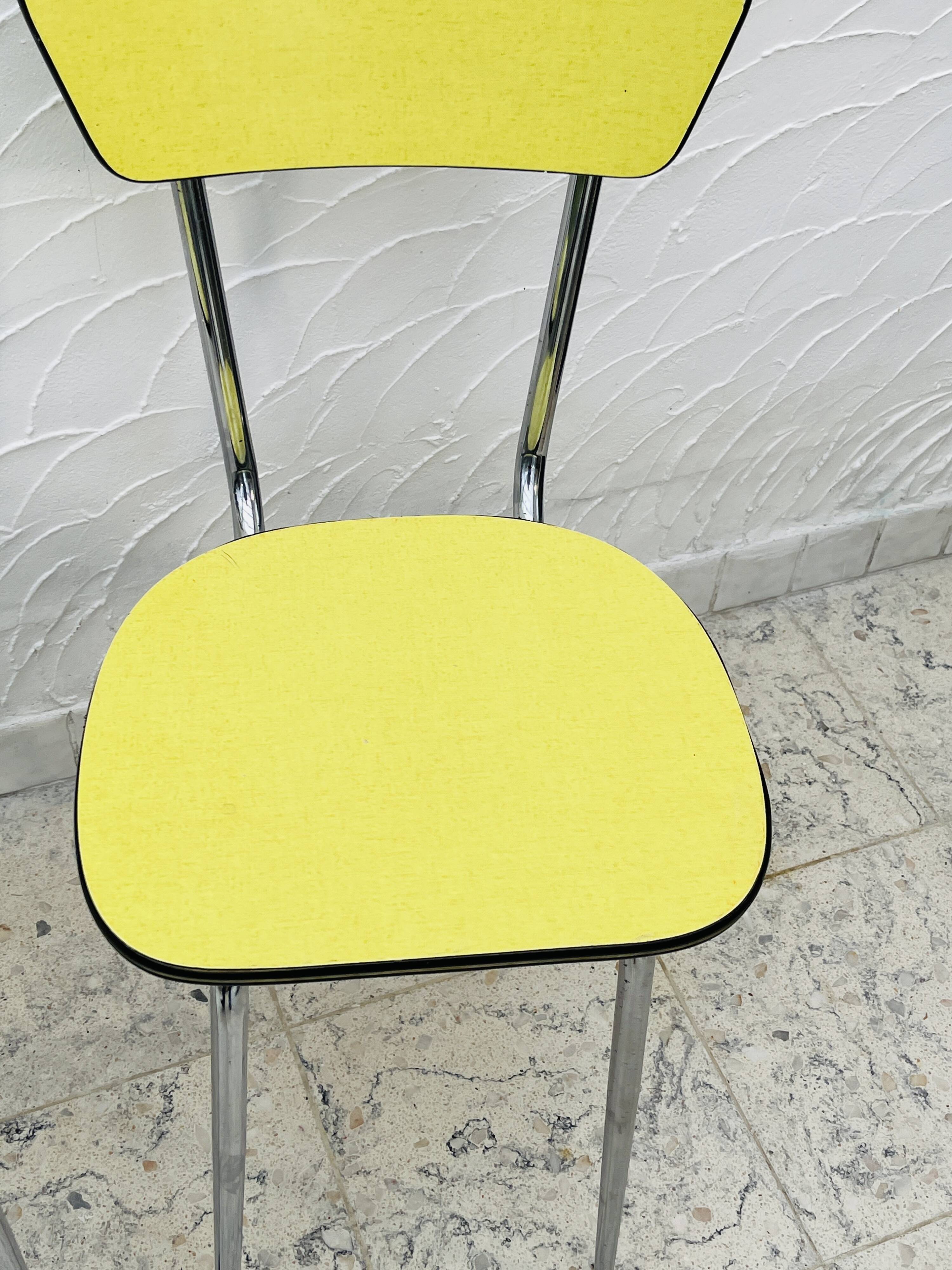 Pair of vintage yellow chrome Formica kitchen chairs.