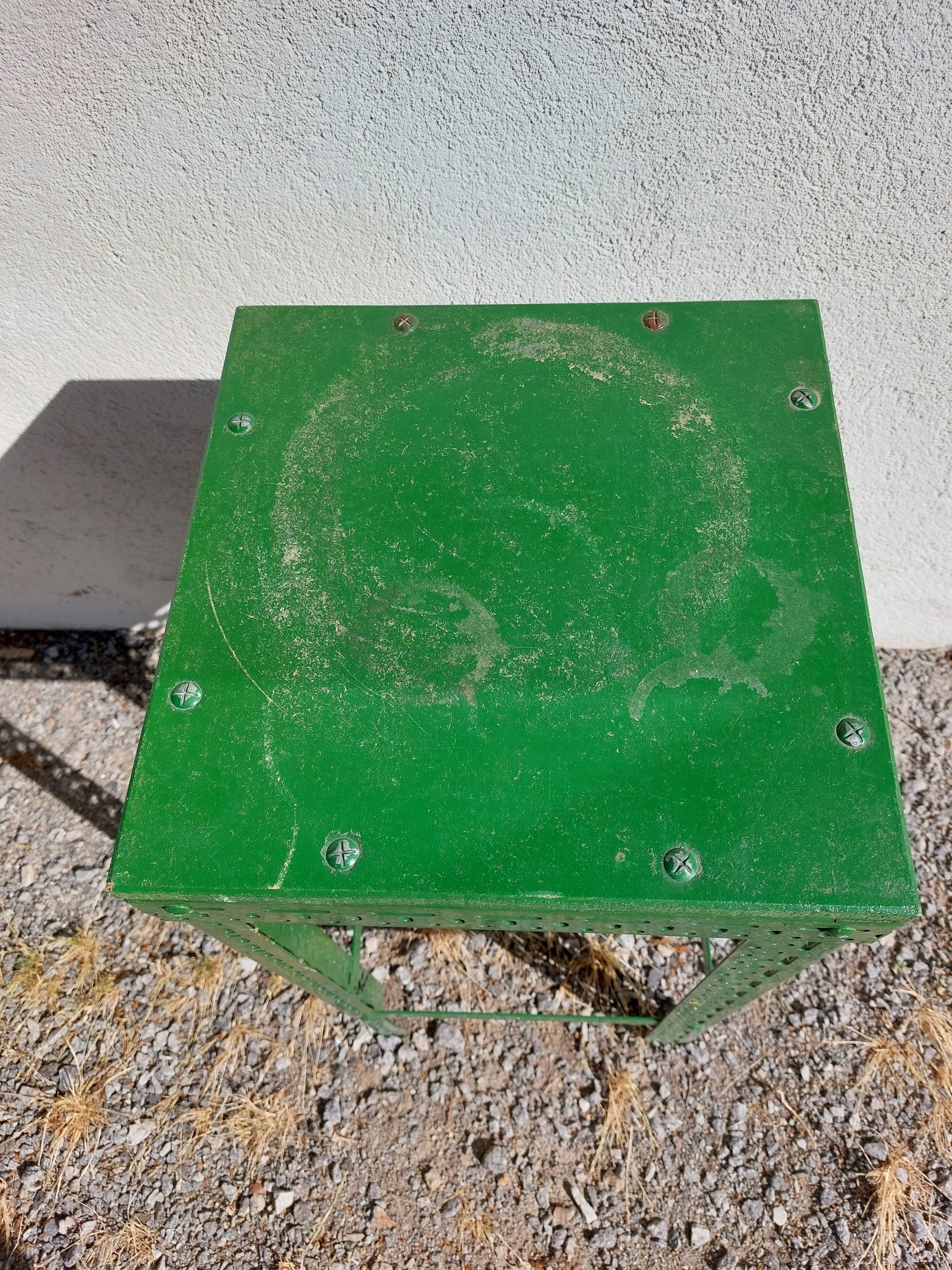 Green metal stool, pedestal table
