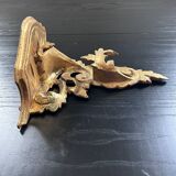 Golden console in rococo style