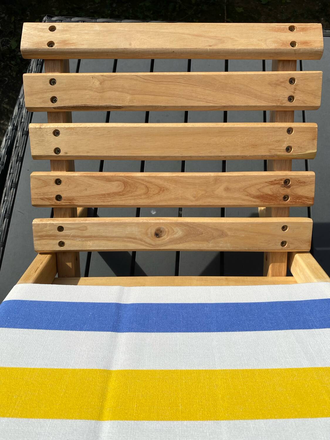 Folding chair in wood and striped fabric