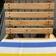 Folding chair in wood and striped fabric