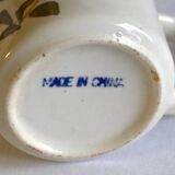 Set of 4 stoneware cups/mugs with blue floral designs, made in China.