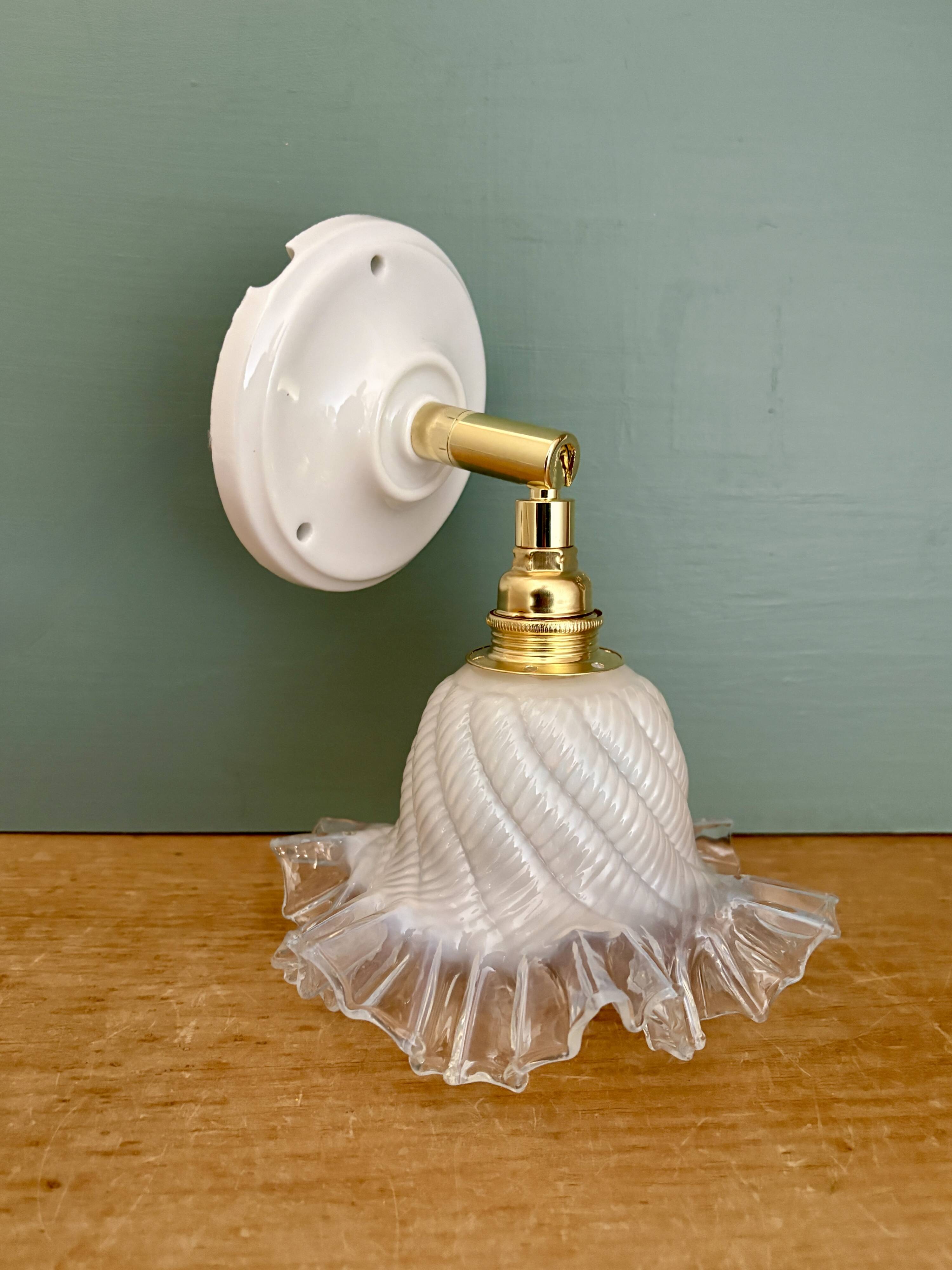 Vintage tulip glass wall light in transparent, slightly pearlescent white.