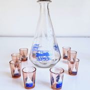 Carafe and 9 liquor glasses decorated with sailboats