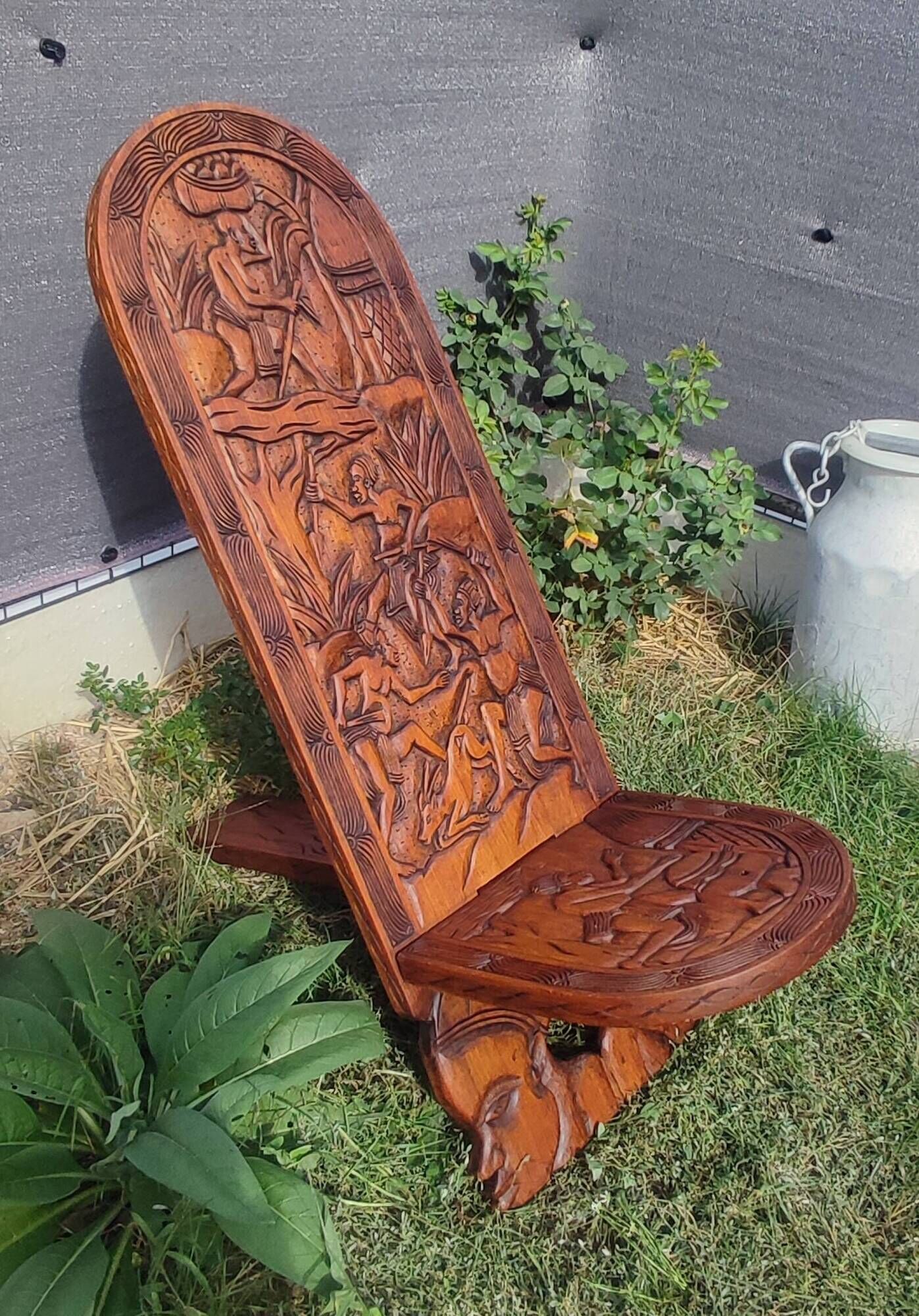 Old African wooden carved talking chair.