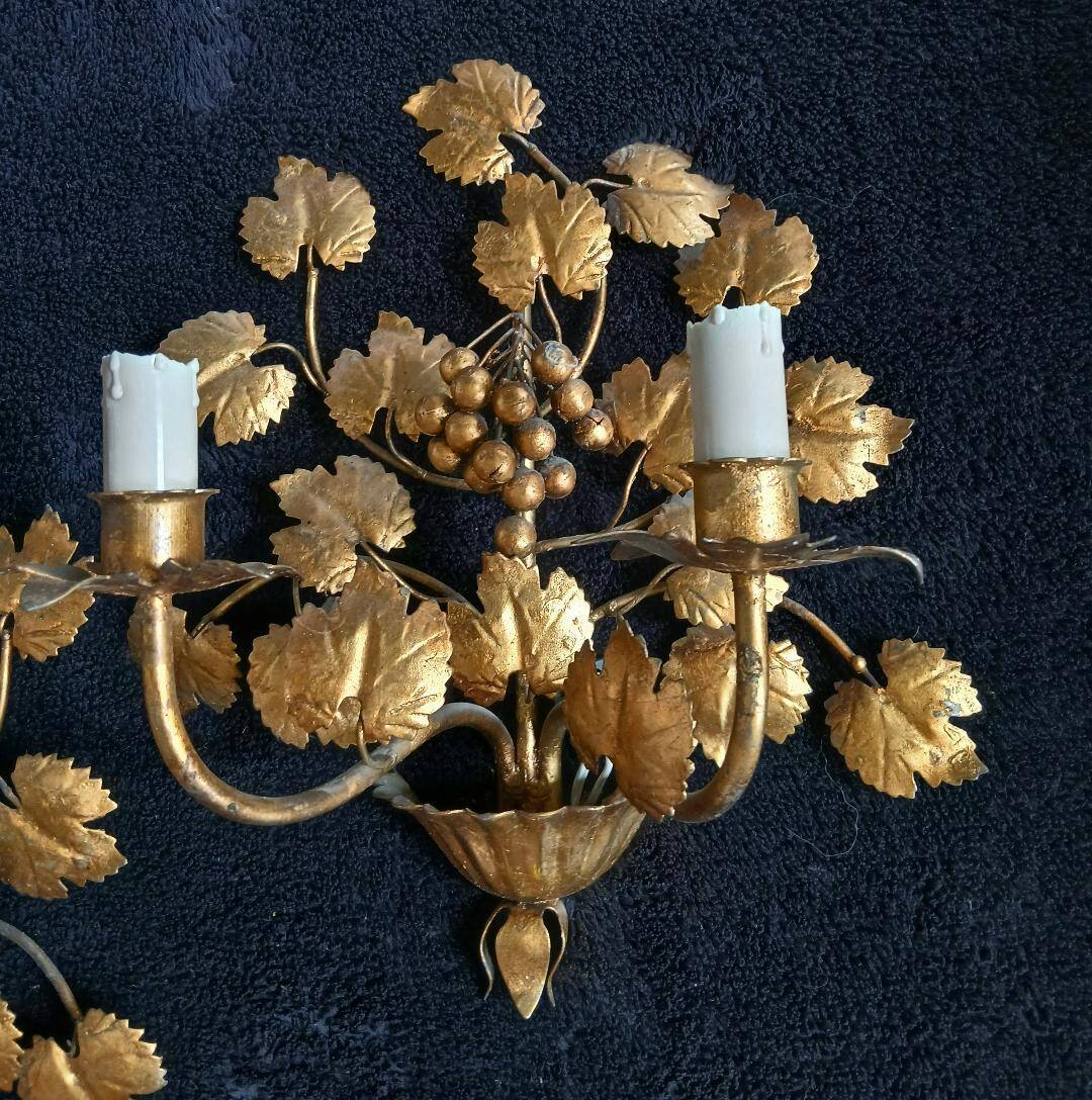 Stunning vintage wall lights in gilded iron with vine and grape decor from Italy.