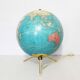 Luminous world map in tripod glass