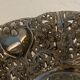 Empty open silver metal pocket