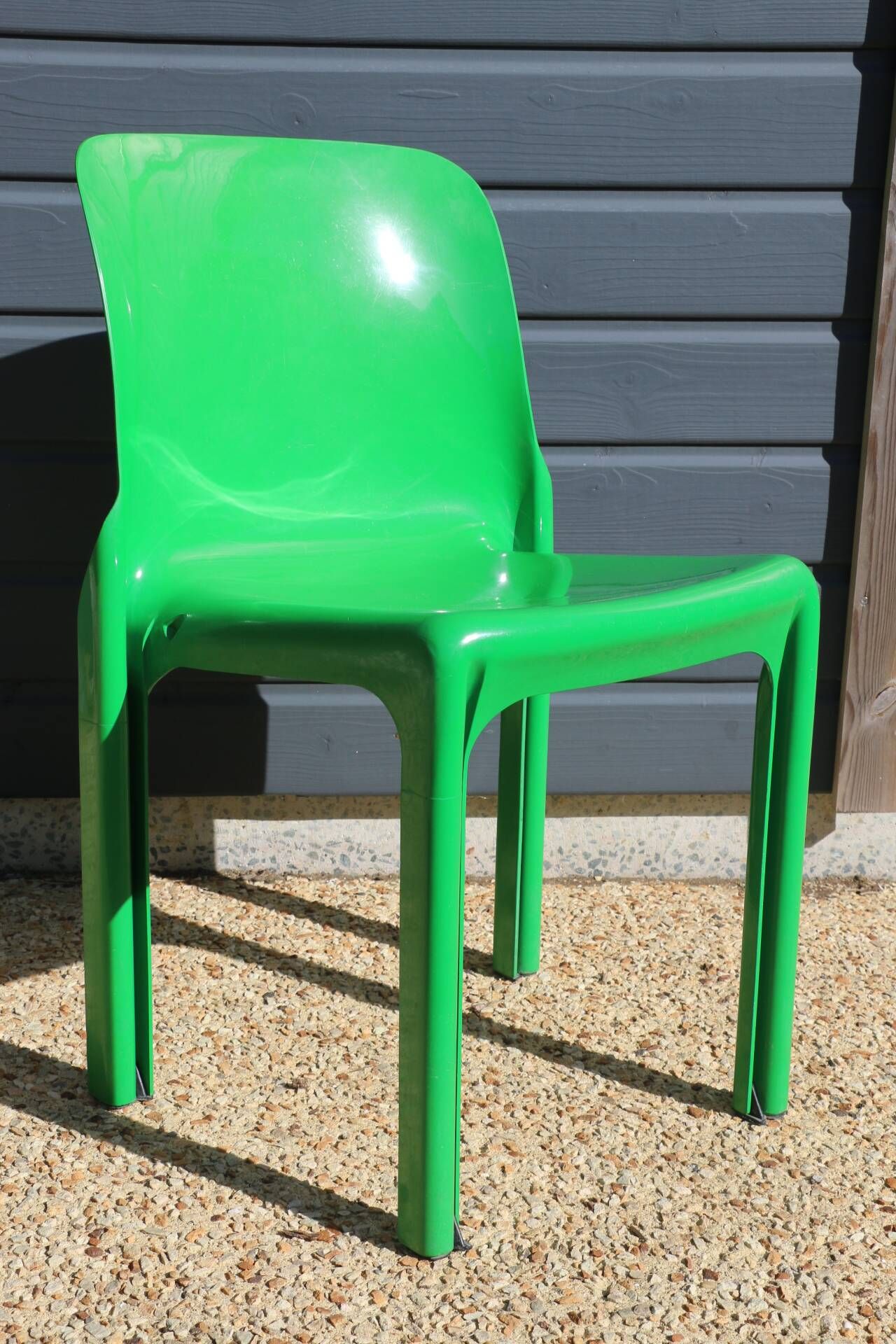 Set of 4 green Selene Magistretti chairs.