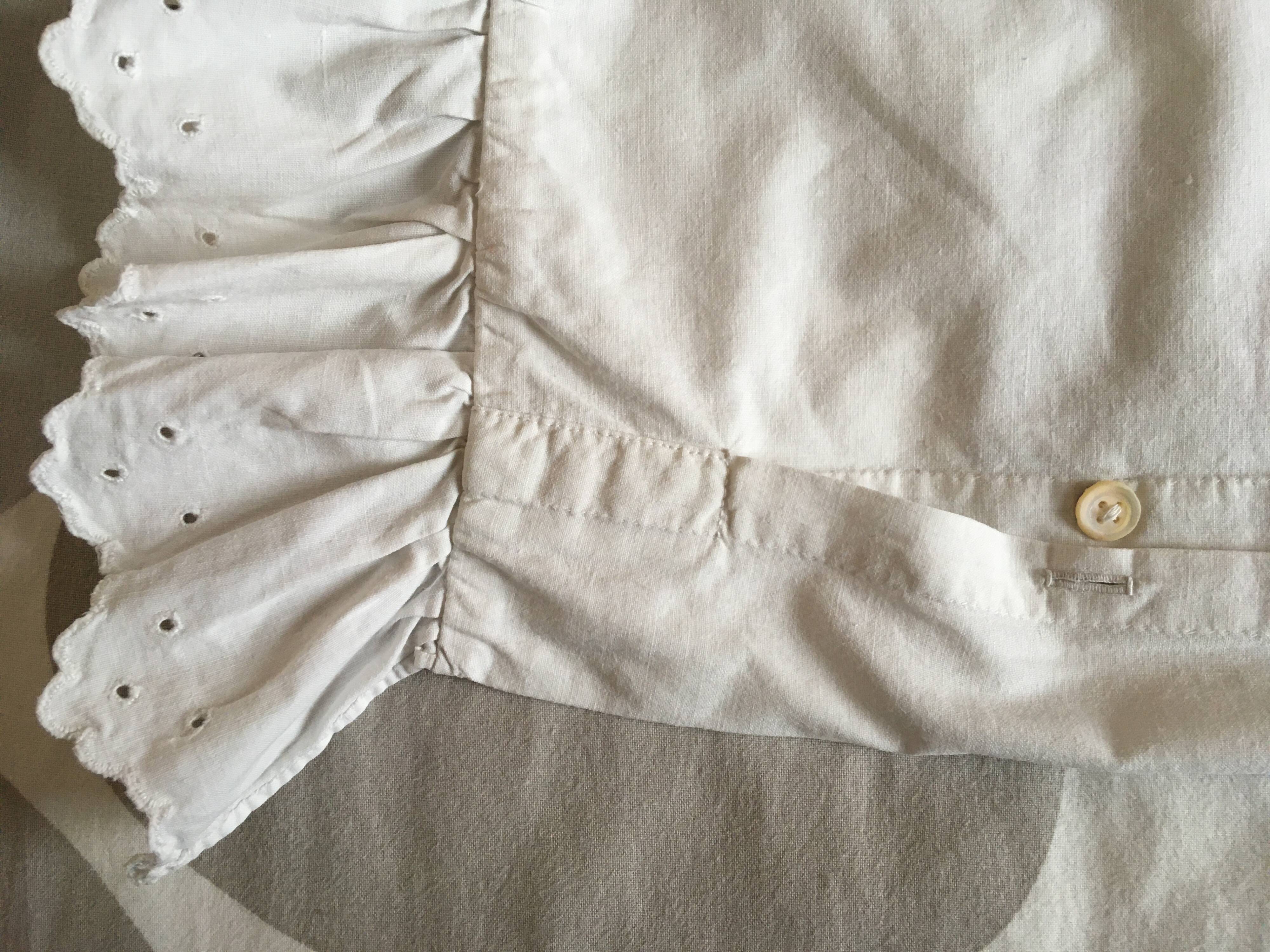 Two half-moon ruffled cushion covers