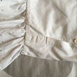 Two half-moon ruffled cushion covers