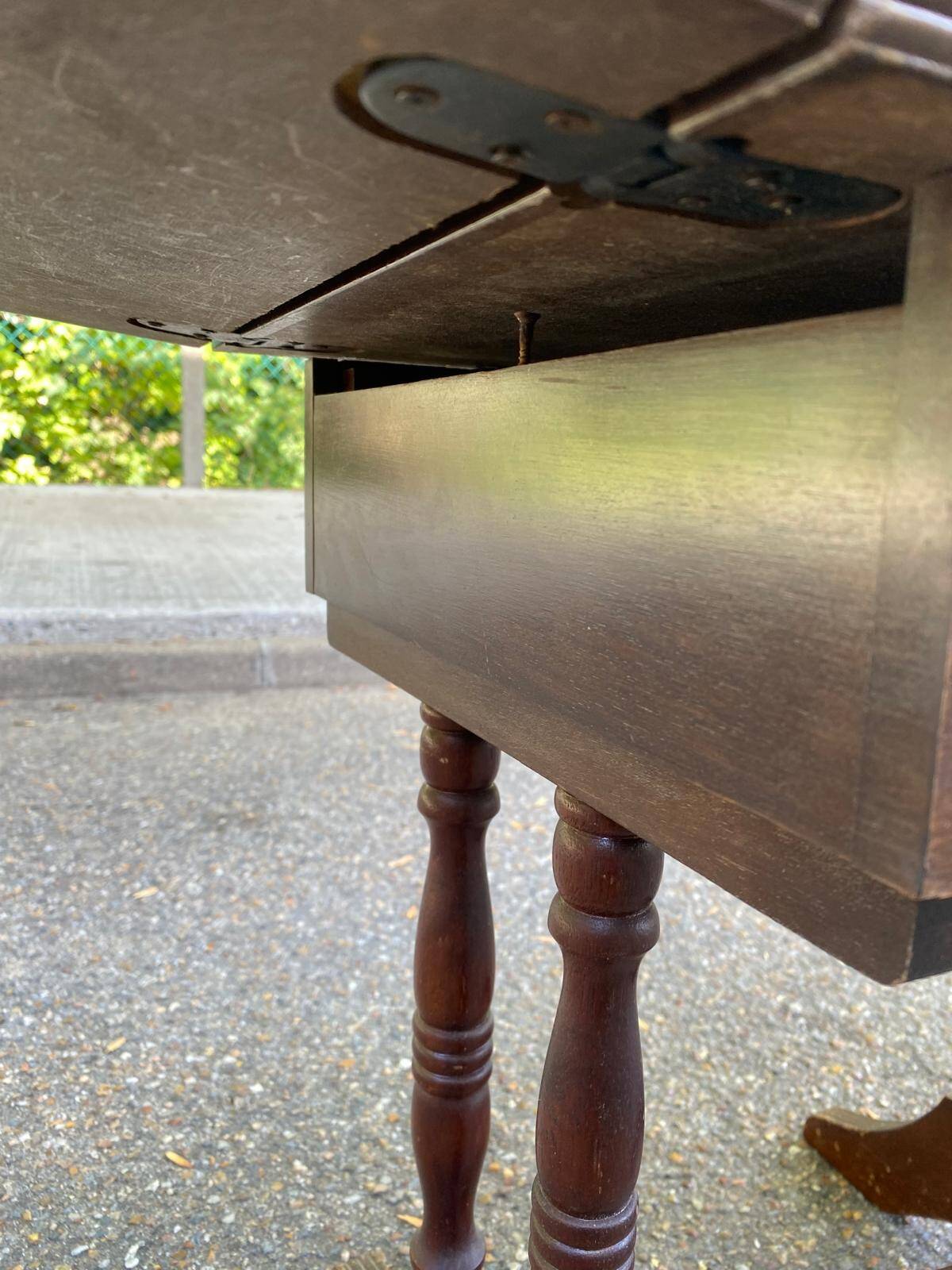 Small drop-leaf side table in English style with leather top & drawer.