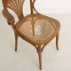 Chaise bistrot avec accoudoirs en bois cintré et assise en cannage