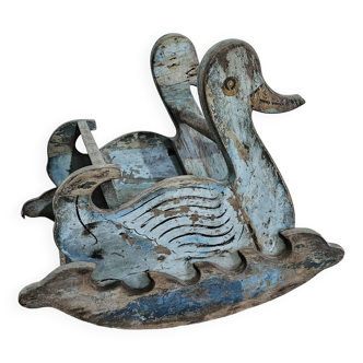 Old children's rocking swan in Burmese teak