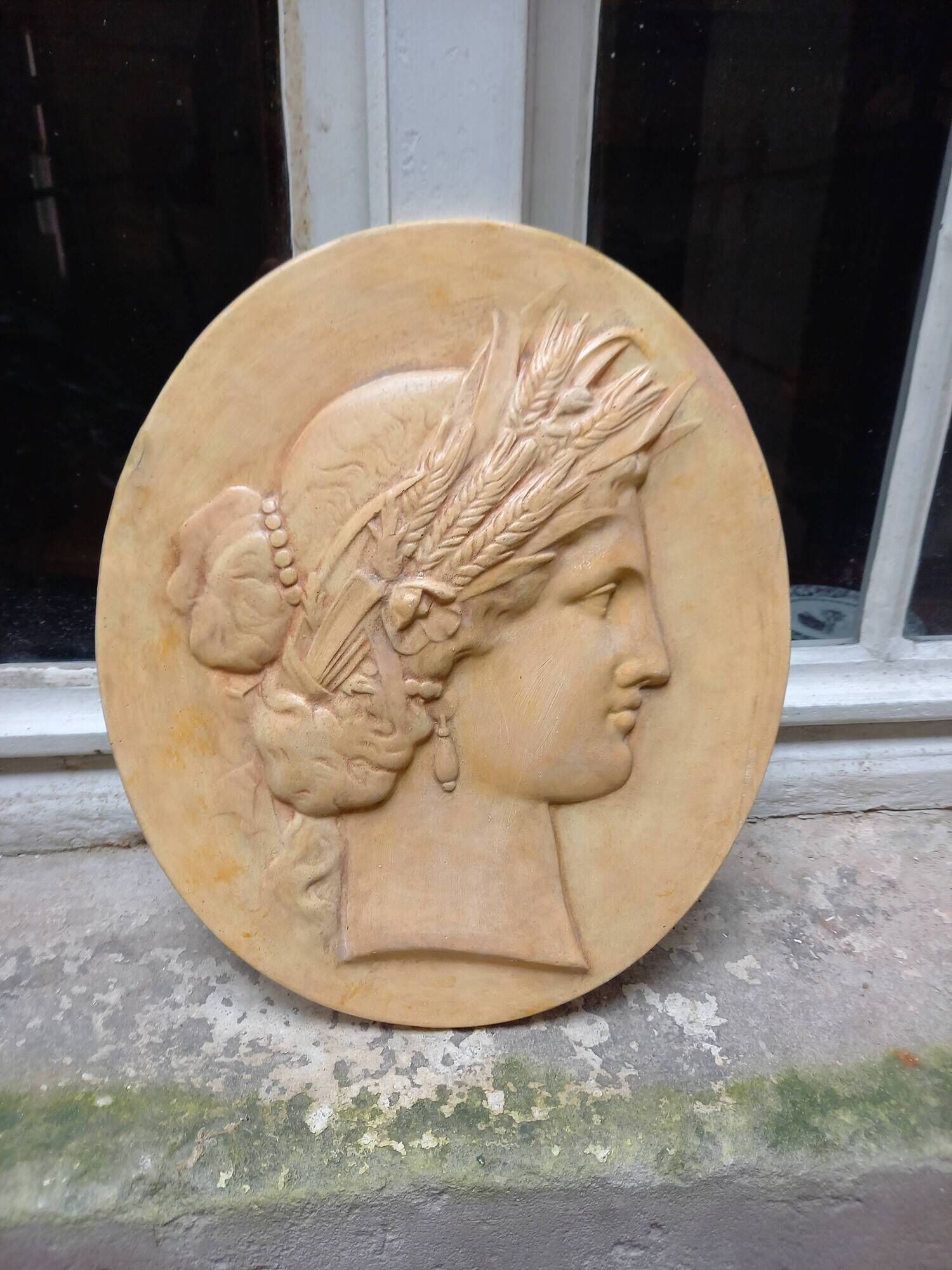 Plaster medallion, high relief, yellow ochre patina, representing the Roman divinity Ceres