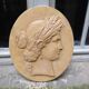Plaster medallion, high relief, yellow ochre patina, representing the Roman divinity Ceres