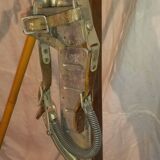 pair of vintage wooden Skis and their bats.