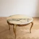 Baroque style coffee table with marble and gilded wood.