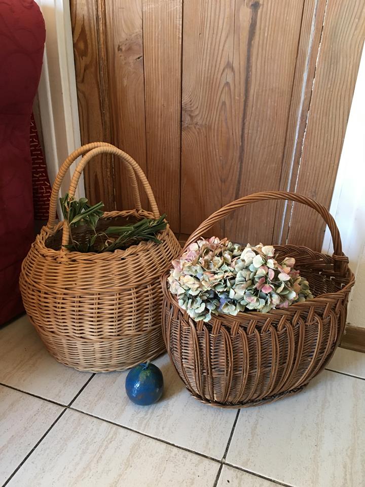Round basket Wicker braided with two handles.