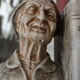 Book-clamps couple of realistic old men in plaster