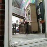 White and gold patinated sculpted mirror