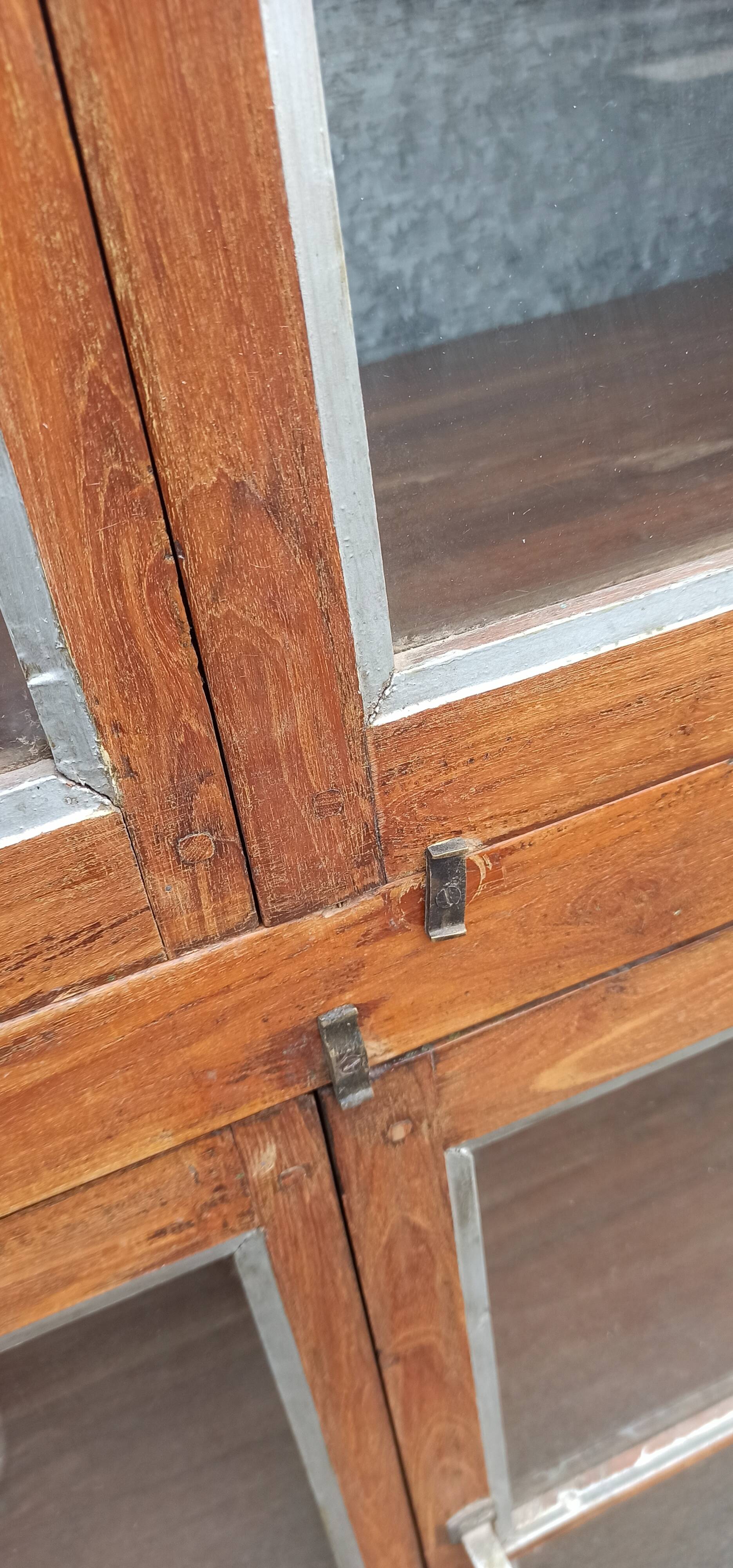 Old glass cabinet in wood and metal