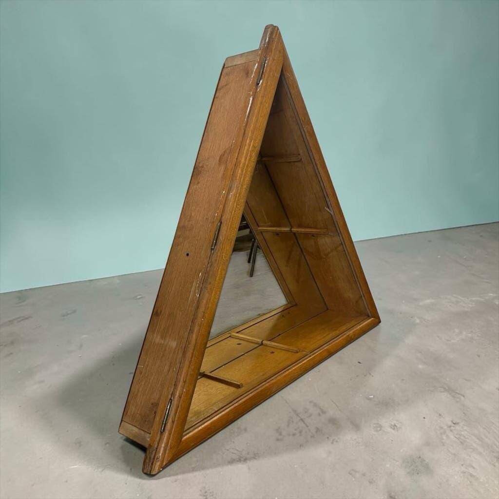 Vintage shallow wall display cabinet with a mirrored back.