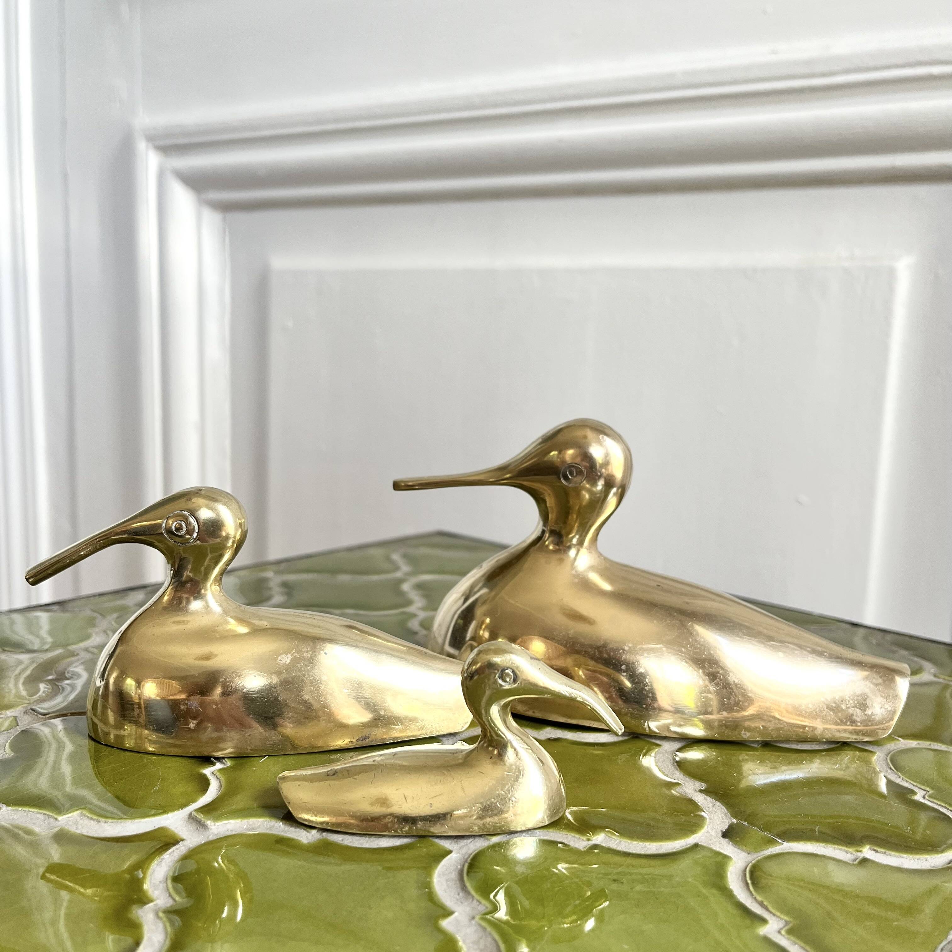 Three brass ducks from the 1950s