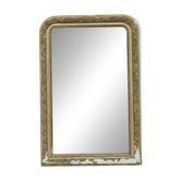Large Louis Philippe mirror in carved gilded wood with mercury glass.