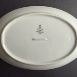 4 small oval porcelain dishes